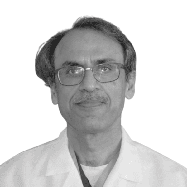 A man with glasses and a mustache wearing a white lab coat, facing forward against a plain white background.